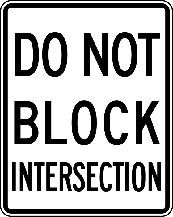 Do Not Block Intersection sign: white rectangle with the words DO NOT BLOCK INTERSECTION.
