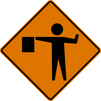 Flagger Ahead sign: orange diamond with a person holding a flag out to the side.