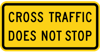 Cross Traffic Does Not Stop sign: yellow rectangular plaque reading CROSS TRAFFIC DOES NOT STOP.
